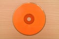 Orange CD or DVD on the table Royalty Free Stock Photo