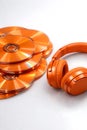 Orange CDs and Headphones on White Royalty Free Stock Photo