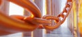 Orange chain link connecting pillars in a bright environment, showcasing strength and unity, copy space for text Royalty Free Stock Photo