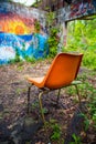 Orange chair in abandoned building