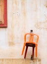 Orange chair hanging on the wall of a traditional house in the old city of Nicosia, Cyprus Royalty Free Stock Photo