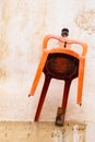 Orange chair hanging on the wall of a traditional house in the old city of Nicosia, Cyprus Royalty Free Stock Photo