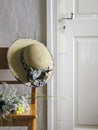 Orange Chair, Hat and Old Farmhouse Door Royalty Free Stock Photo