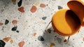 Orange Chair on Terrazzo Floor with Sunbeams Royalty Free Stock Photo