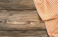 Orange checkered picnic cloth on wooden background,food design tabletop,backdrop