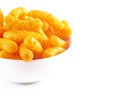 Orange Cheddar Cheese Puffs on a White Background Royalty Free Stock Photo