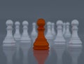 An orange chess piece standing in the middle of another white chess piece, 3d illustration