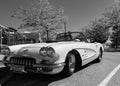 An orange 1959 Chevrolet Corvette Convertible is at summer park. Vintage Chevrolet Corvette a classic cabrio car Royalty Free Stock Photo