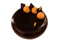 Orange chocolate cake with chocolate decorations and whipped white chocolate cream