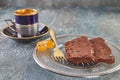 Orange chocolate Terrine on plate with cup of coffee