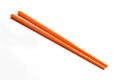 Orange chopsticks isolated on white Royalty Free Stock Photo