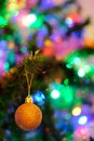 Orange Christmas ball decoration on a Christmas tree with nice blurry background Royalty Free Stock Photo