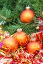 Orange Christmas balls, red tinsel on Xmas tree 1 Royalty Free Stock Photo