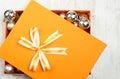 Orange Christmas gift box filled with baubles Royalty Free Stock Photo