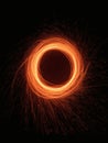 An orange circle of energy radiates on a black, dimensionless plane. Royalty Free Stock Photo