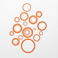 Orange circles of varying sizes are arranged on a white background Royalty Free Stock Photo