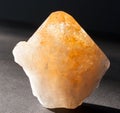 Orange citrine crystal mineral on black background