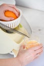 Orange citrus juice making with juicer device Royalty Free Stock Photo