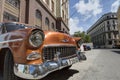 Orange classic car in Old Havana, Cuba Royalty Free Stock Photo