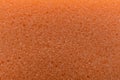 Orange cleaning sponge as background, top view Royalty Free Stock Photo