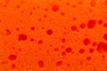 Orange cleaning sponge as background, top view Royalty Free Stock Photo