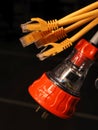 Orange and clear industrial 240V power and several yellow data plugs Royalty Free Stock Photo