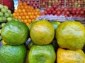 Green oranges display on the fruits market,orange close up view