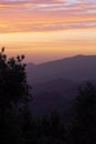 Orange clouds on a mountain landscape sunset sky Royalty Free Stock Photo