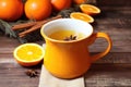 orange and clove spiced cider in ceramic mug