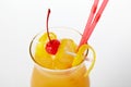 Orange cocktail drink with lemon and cherry Royalty Free Stock Photo