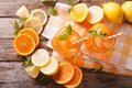 Orange cocktail with ice and mint in a glass jar closeup. horizontal top view Royalty Free Stock Photo