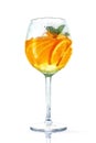 orange cocktail in wine glass with mint on white background. misted glass Royalty Free Stock Photo