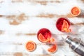 Orange cocktails with blood oranges and a shaker, overhead flat lay shot Royalty Free Stock Photo