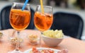 Orange cocktails with finger food