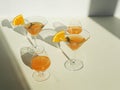 Orange cocktails with orange on a white background