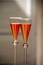 Orange cocktails in glasses with a conical shape