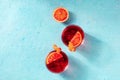 Orange cocktails, overhead flat lay shot on a blue background Royalty Free Stock Photo