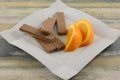 Orange and cocoa cream wafers cookies and orange slices