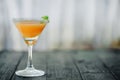 Orange coctail on black wooden table at blurred background Royalty Free Stock Photo