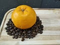 Orange and coffee beans on the wood tray Royalty Free Stock Photo