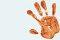 Orange color handprint on a white background