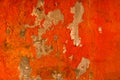 Orange color painted on concrete wall are peeling. Old and dirty wall texture background with space Royalty Free Stock Photo