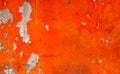Orange color painted on concrete wall are peeling. Old and dirty wall texture background Royalty Free Stock Photo