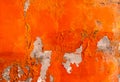 Orange color painted on concrete wall are peeling. Old and dirty wall texture background Royalty Free Stock Photo