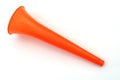 A orange color plastic vuvuzela horn isolated on white background