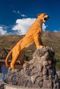 Cusco / Peru - May 29.2008: Orange color Puma the animal statue in Calca town in Peruvian Andes
