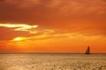 seascape image with shiny sea and sailboat over cloudy sky Royalty Free Stock Photo