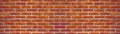 Orange colored abstract damaged rustic brick wall brickwork stonework masonry texture background banner panorama panoramic pattern