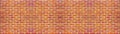 Orange colored abstract damaged rustic brick wall brickwork stonework masonry texture background banner panorama panoramic pattern