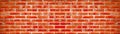 Orange colored abstract damaged rustic brick wall brickwork stonework masonry texture background banner panorama panoramic pattern